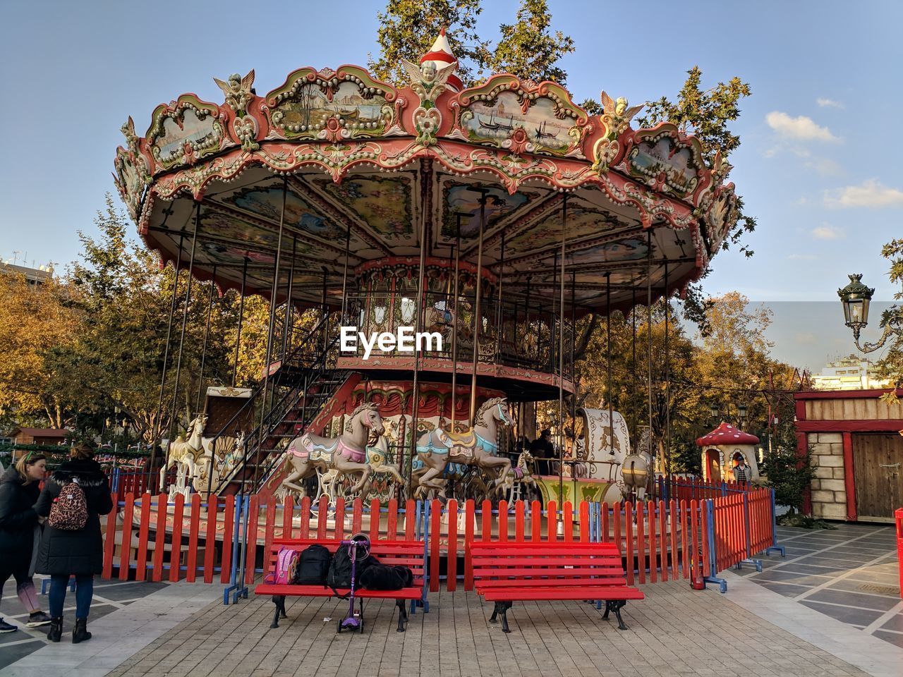 PEOPLE AT AMUSEMENT PARK AGAINST SKY