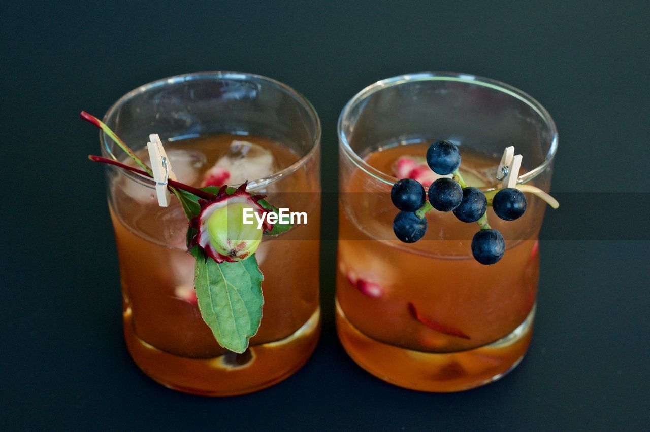 CLOSE-UP OF DRINK AGAINST GLASS