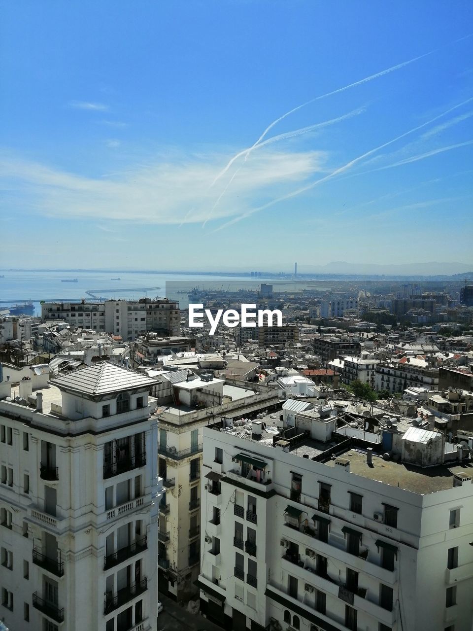 High angle view of buildings in city against sky