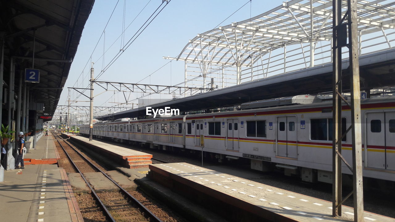 Train at railroad station against sky