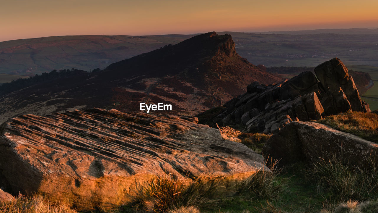 SCENIC VIEW OF ROCKY MOUNTAINS DURING SUNSET