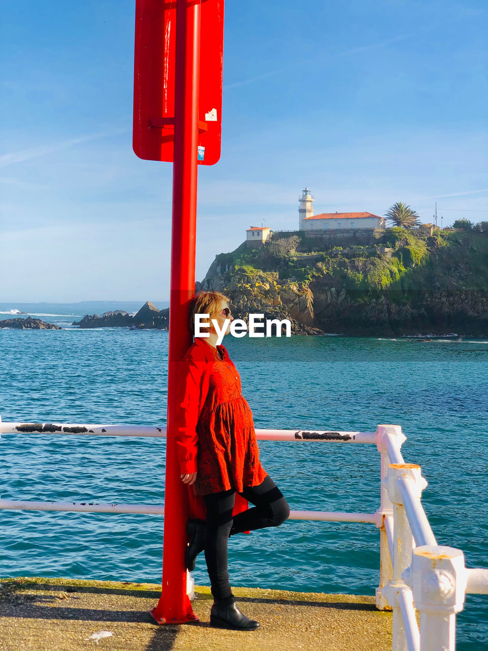 rear view of man standing by railing