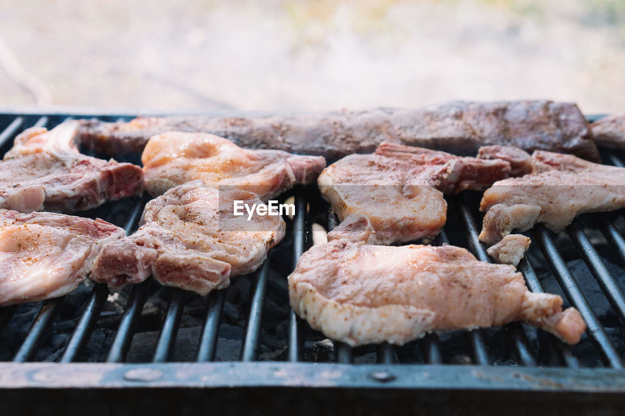 Close-up of pork meat on barbecue grill