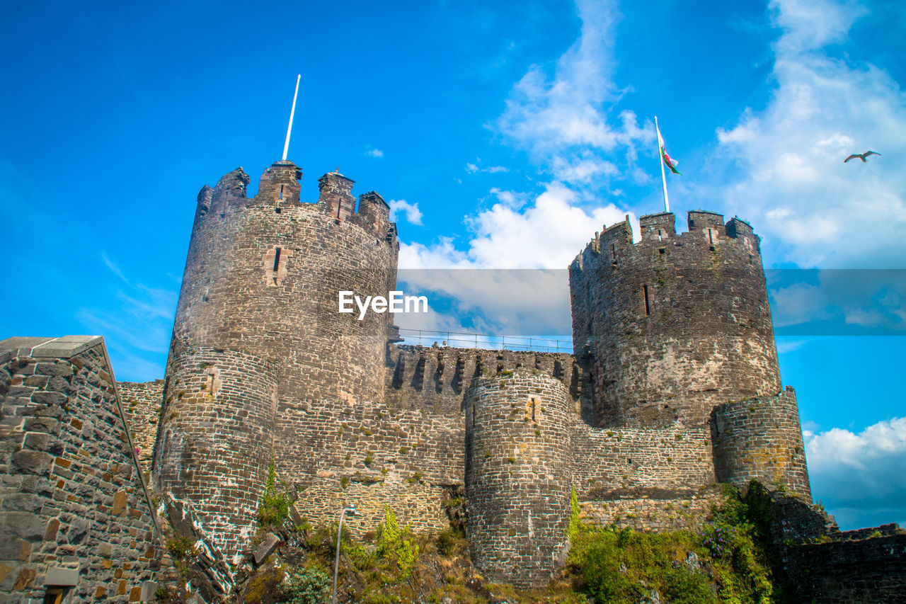 LOW ANGLE VIEW OF CASTLE AGAINST BLUE SKY