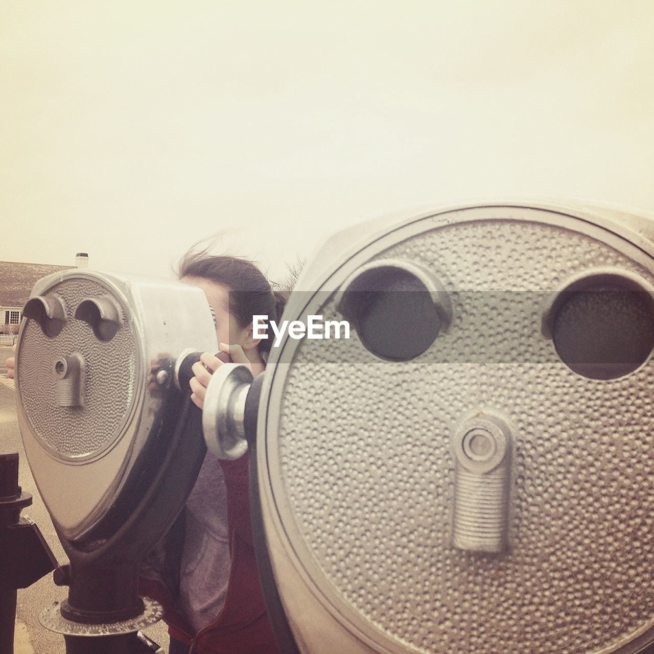 VIEW OF COIN OPERATED BINOCULARS ON WHITE WALL