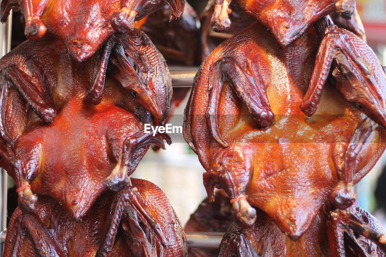 Close-up of roasted peking ducks for sale in market
