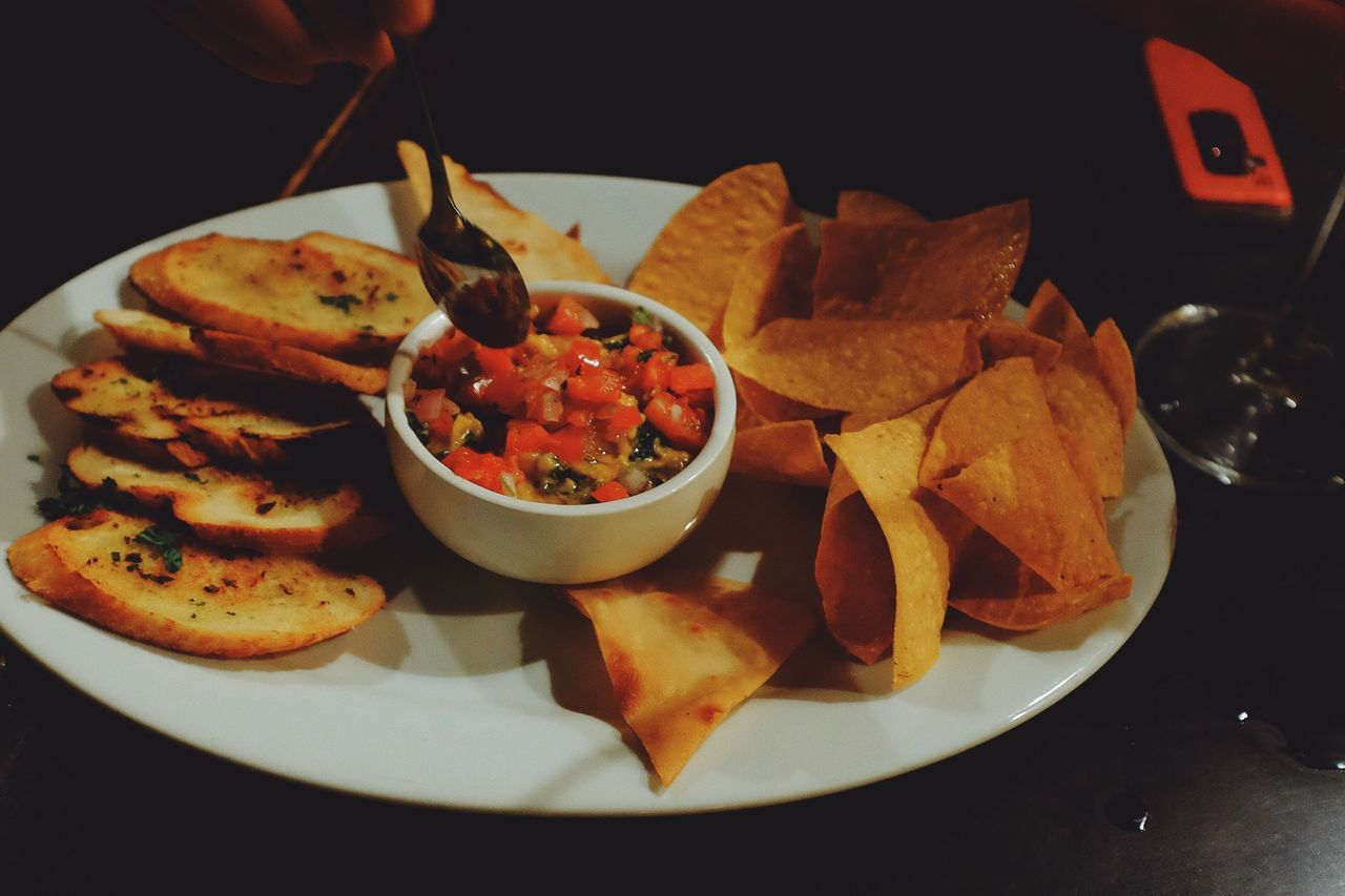 Close-up of snacks with dip