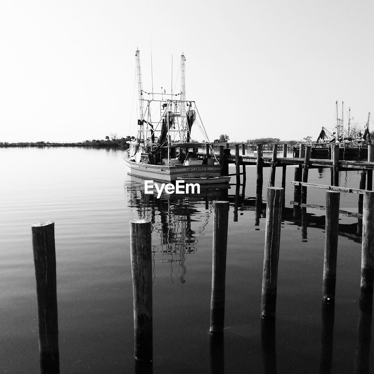 Scenic view of fishing boat against clear sky