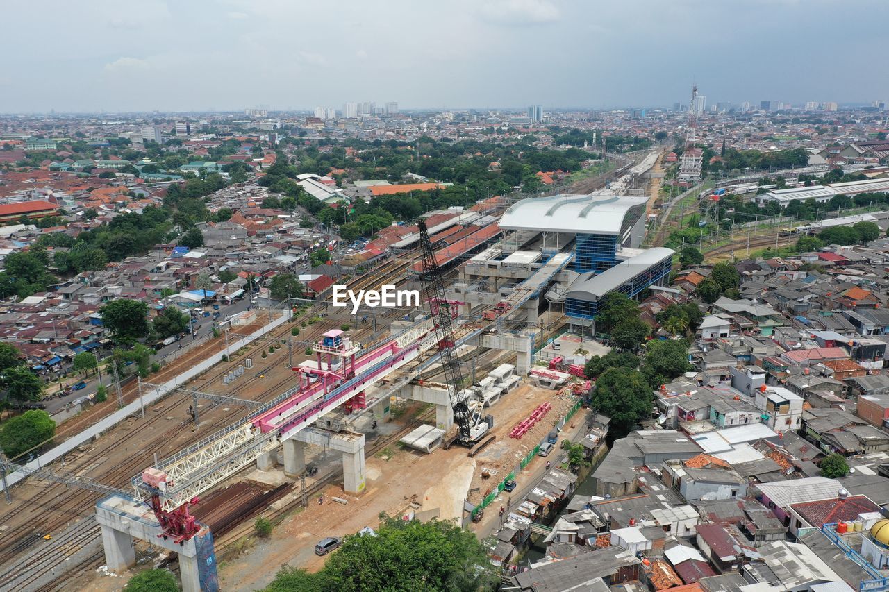 High angle view of rail way amidst buildings in city of jakarta