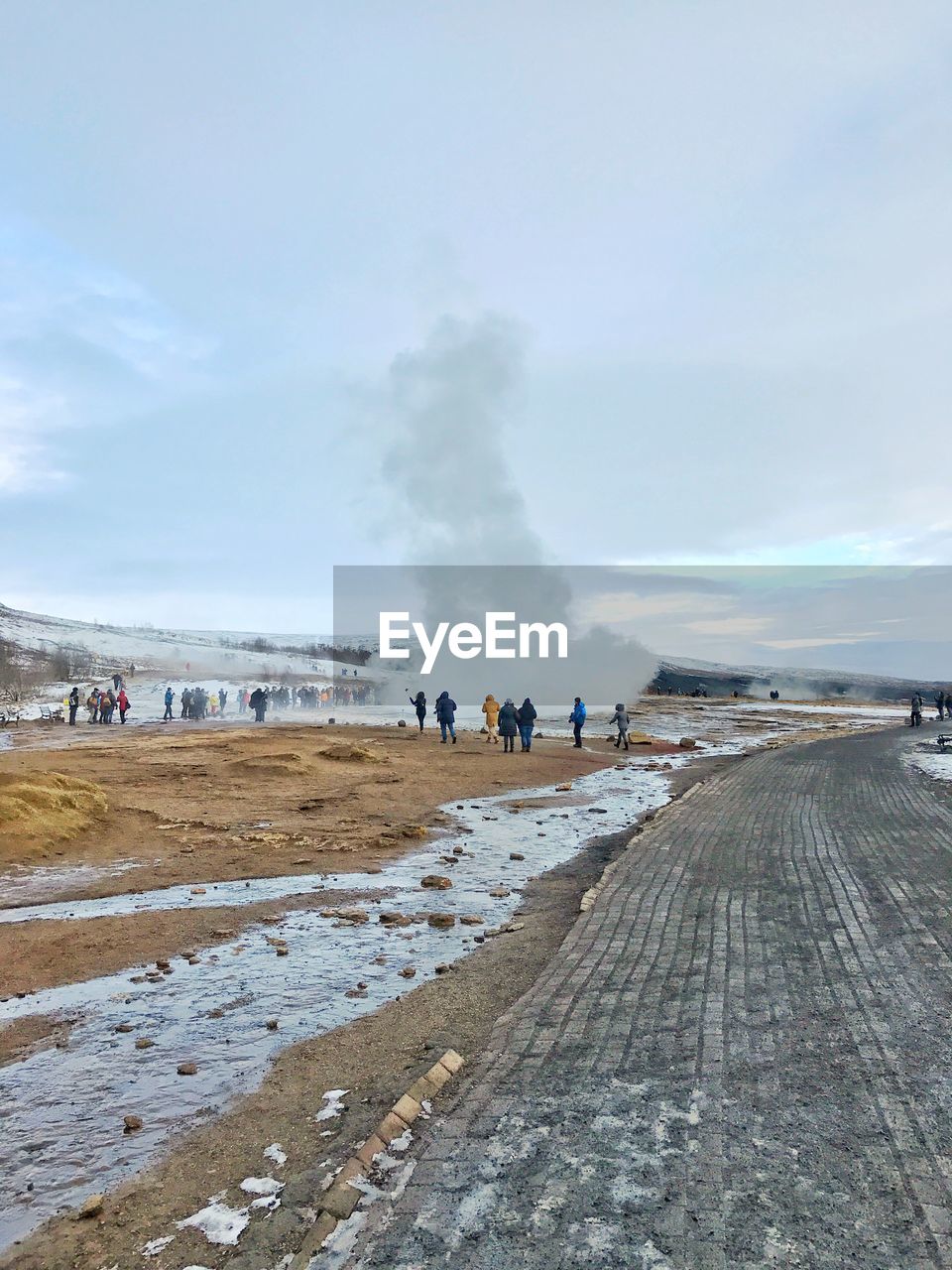 PEOPLE ON LANDSCAPE AGAINST SKY