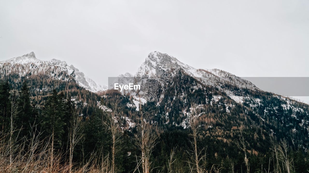 Scenic view of snowcapped mountains against clear sky