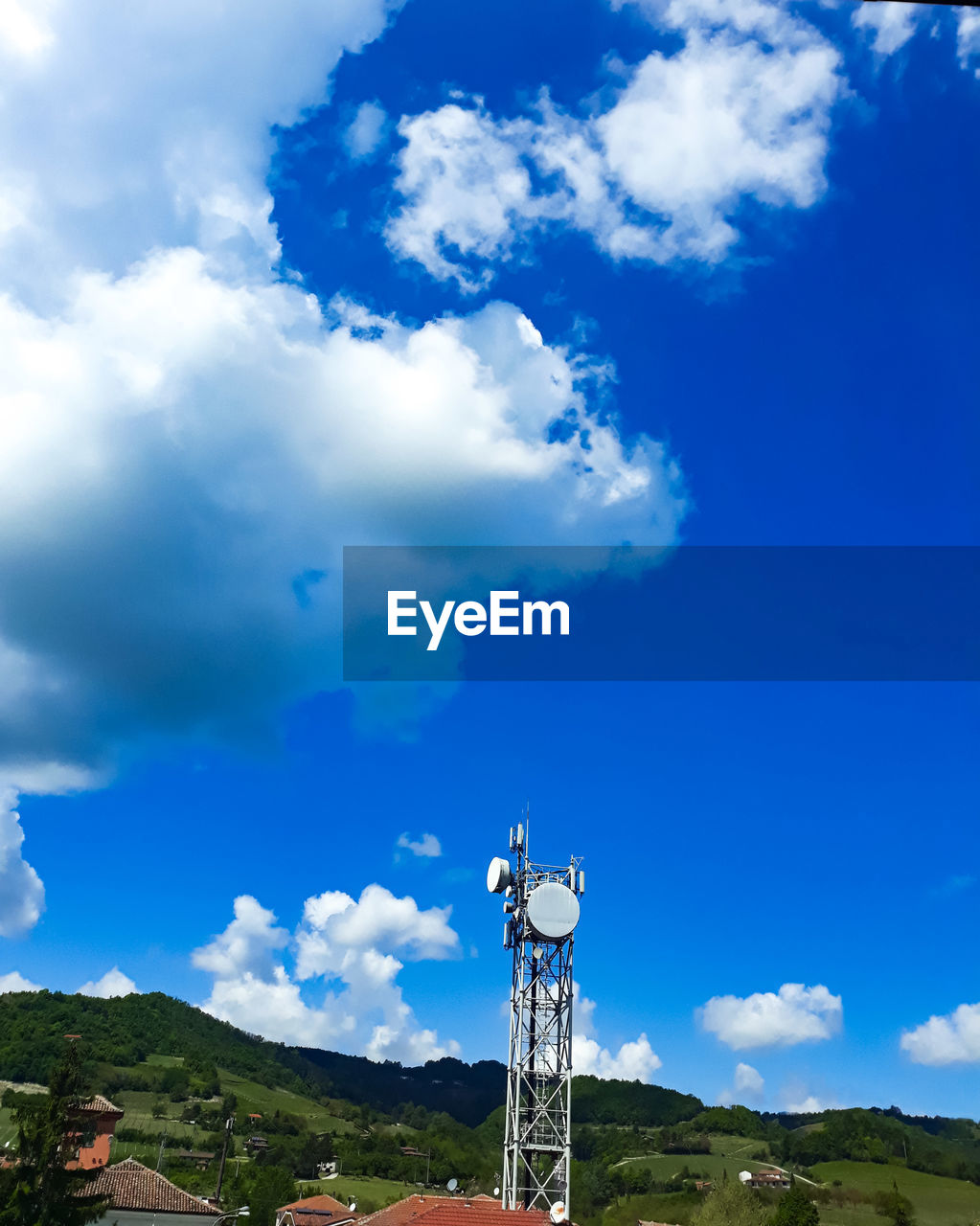 LOW ANGLE VIEW OF TOWER AGAINST BLUE SKY