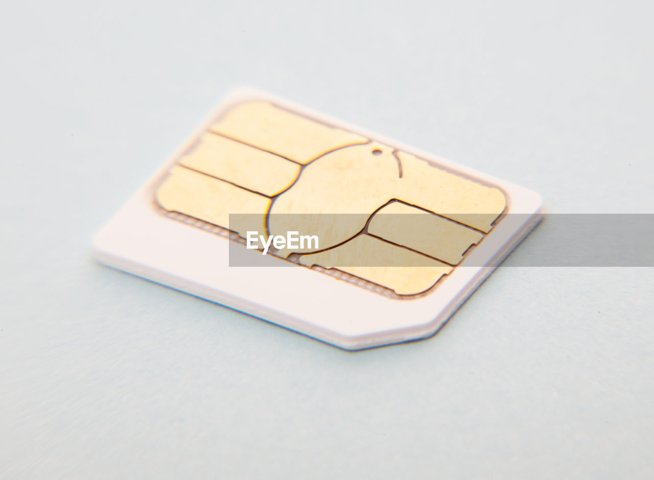 Close-up of sim card on white background