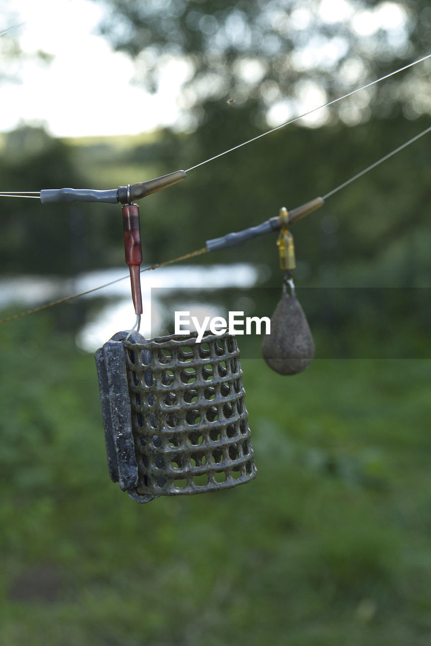 Close-up of clothespins hanging on clothesline