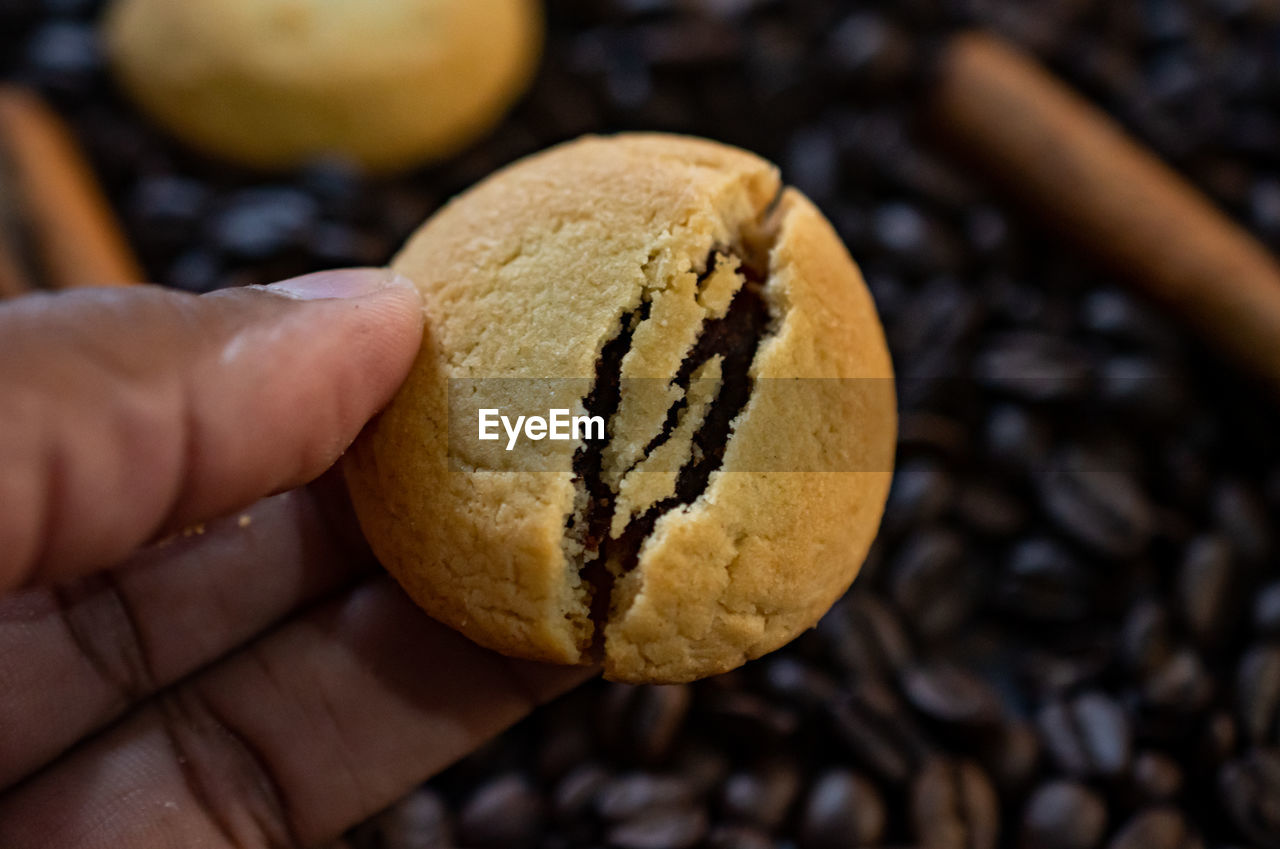 food and drink, hand, food, holding, freshness, close-up, one person, produce, sweet food, focus on foreground, healthy eating, indoors