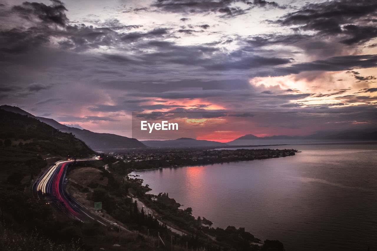 SCENIC VIEW OF LAKE BY MOUNTAINS AGAINST SKY