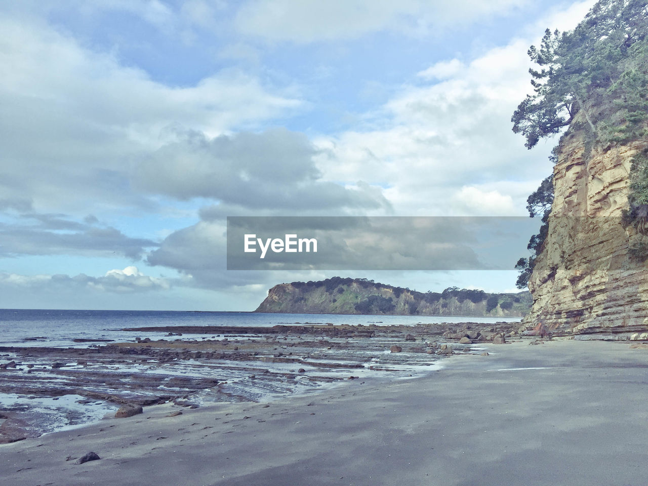 Scenic view of beach against sky