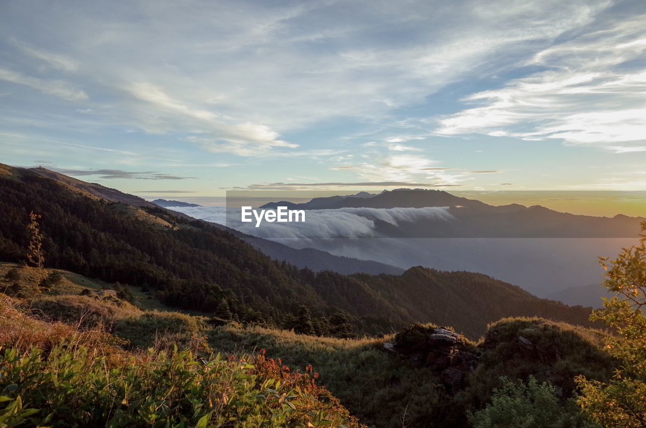 Scenic view of landscape against sky during sunset