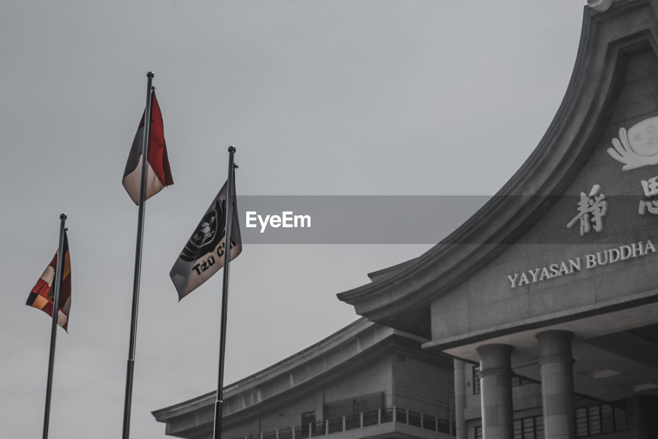 flag, architecture, patriotism, built structure, building exterior, sky, low angle view, no people, nature, city, government, travel destinations, text, history, the past, day, outdoors, politics, communication, politics and government, travel