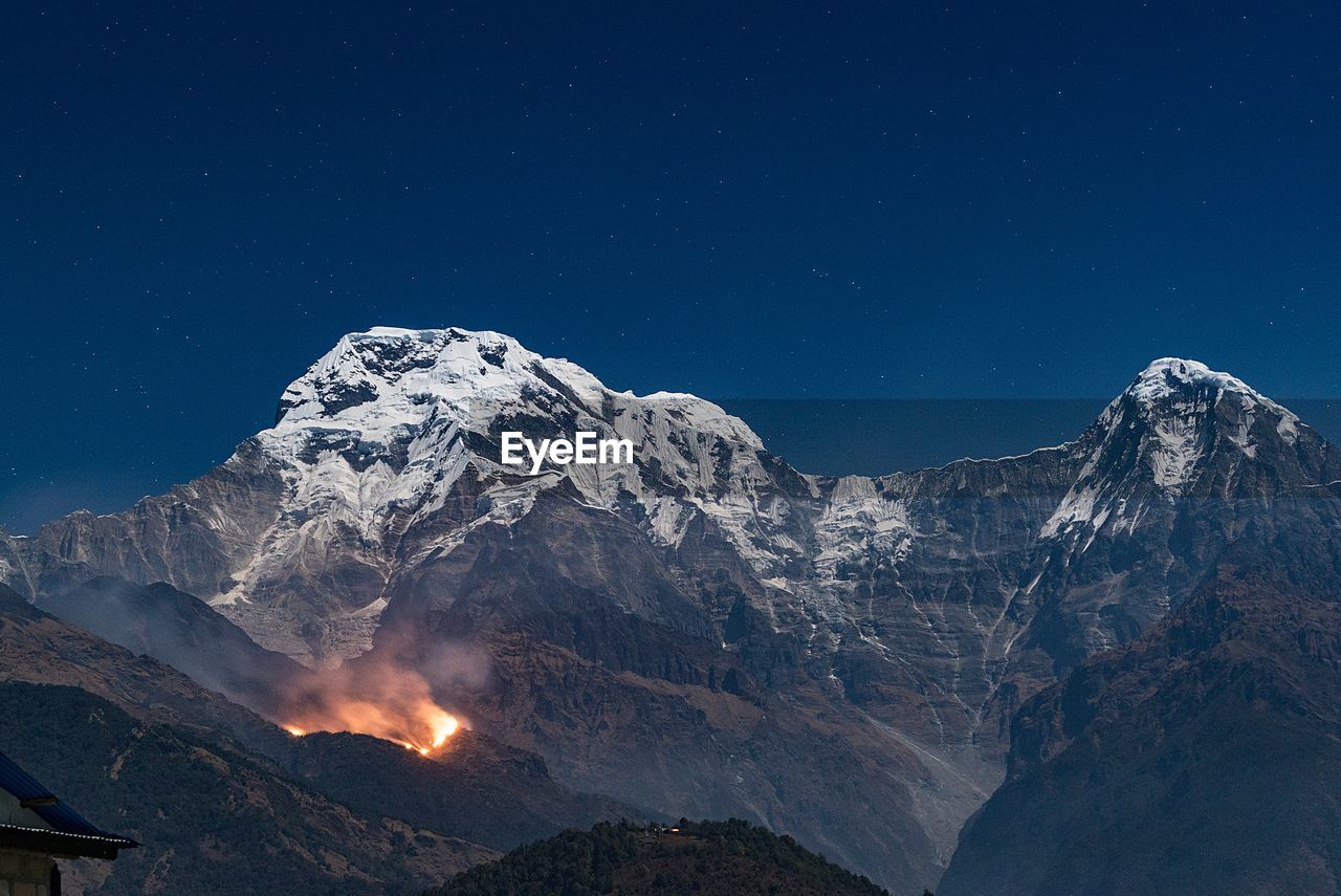 Close-up of mountains against sky at night