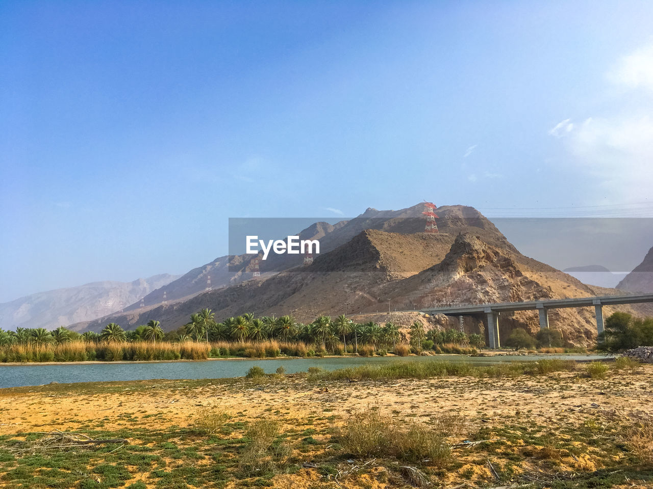 mountain, sky, landscape, wilderness, scenics - nature, nature, environment, beauty in nature, travel destinations, no people, plateau, architecture, mountain range, rural area, land, plant, built structure, water, travel, lake, natural environment, cloud, plain, blue, tranquility, horizon, outdoors, non-urban scene, day, tranquil scene, building, building exterior, tourism, volcano, field