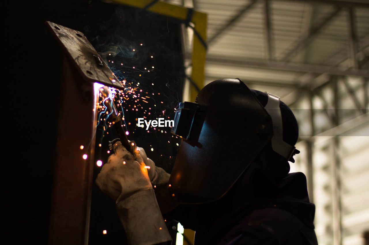 Man working on metal in workshop
