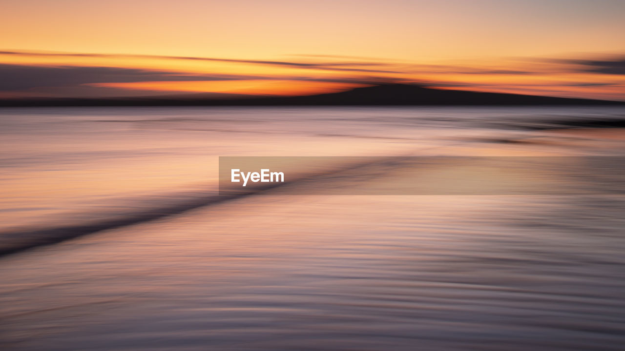 SCENIC VIEW OF SEA AGAINST ROMANTIC SKY