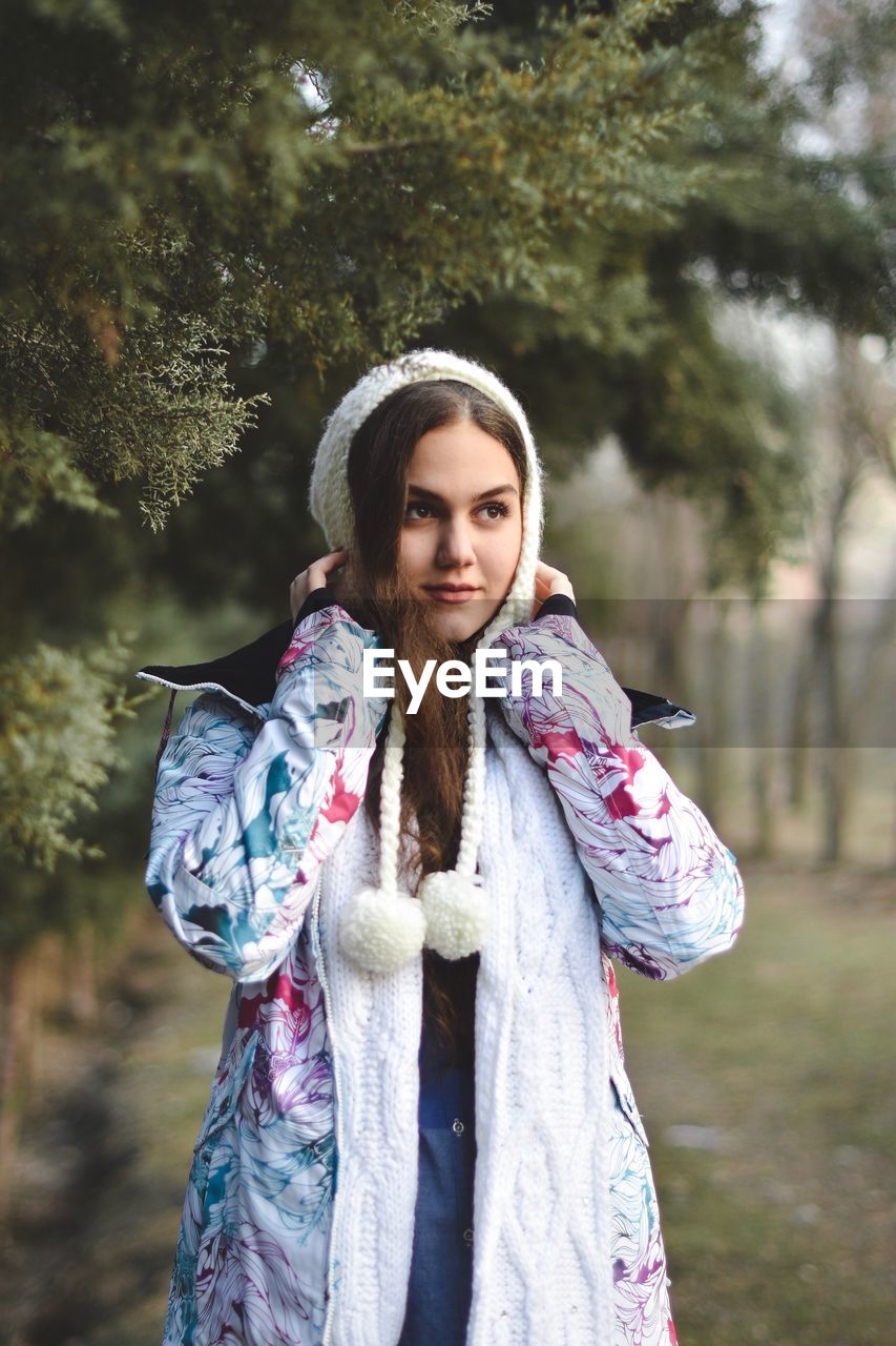 Young woman looking away in park