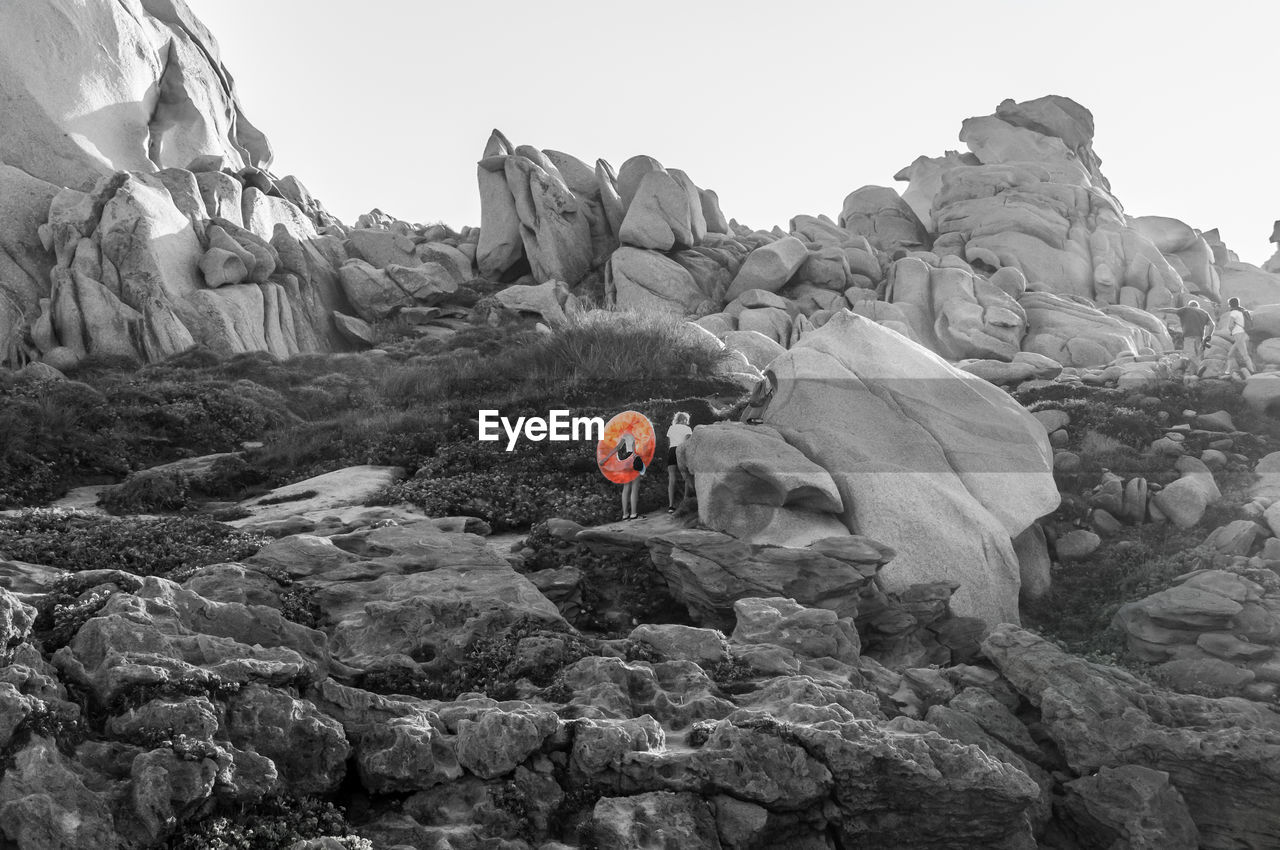 Rock formation on mountain against sky
