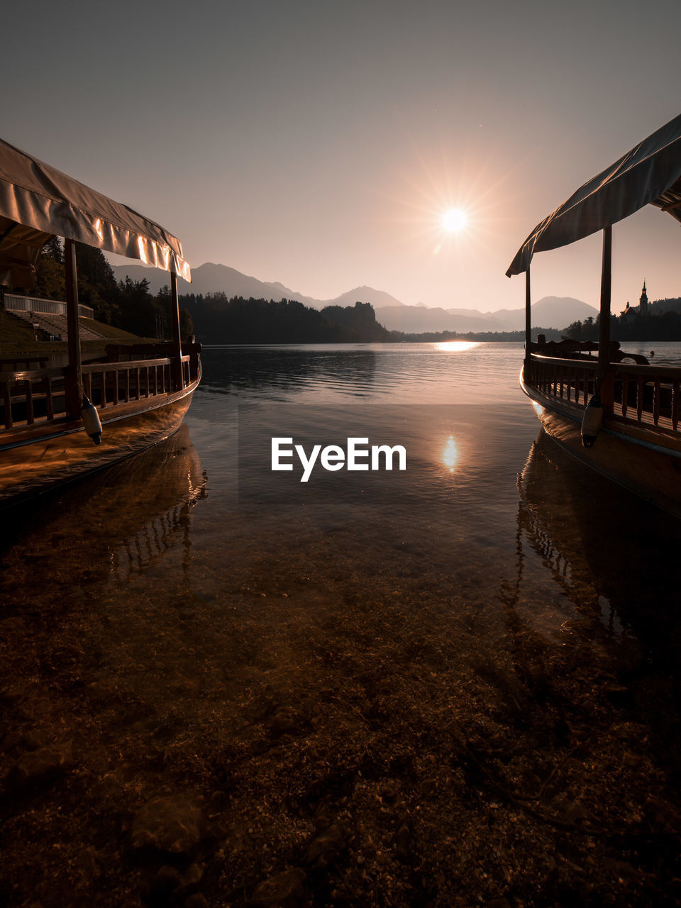 Scenic view of lake against sky during sunset