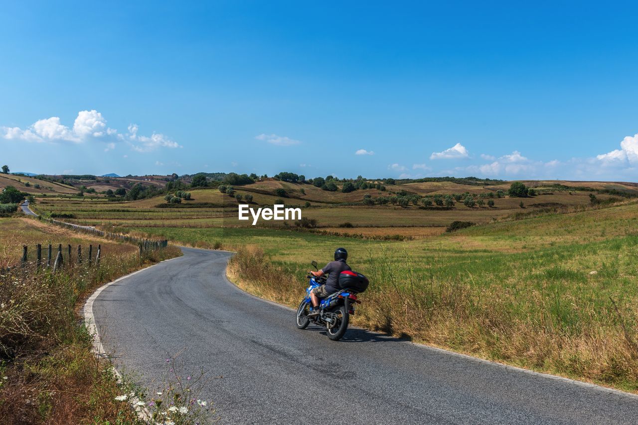 Road passing through field