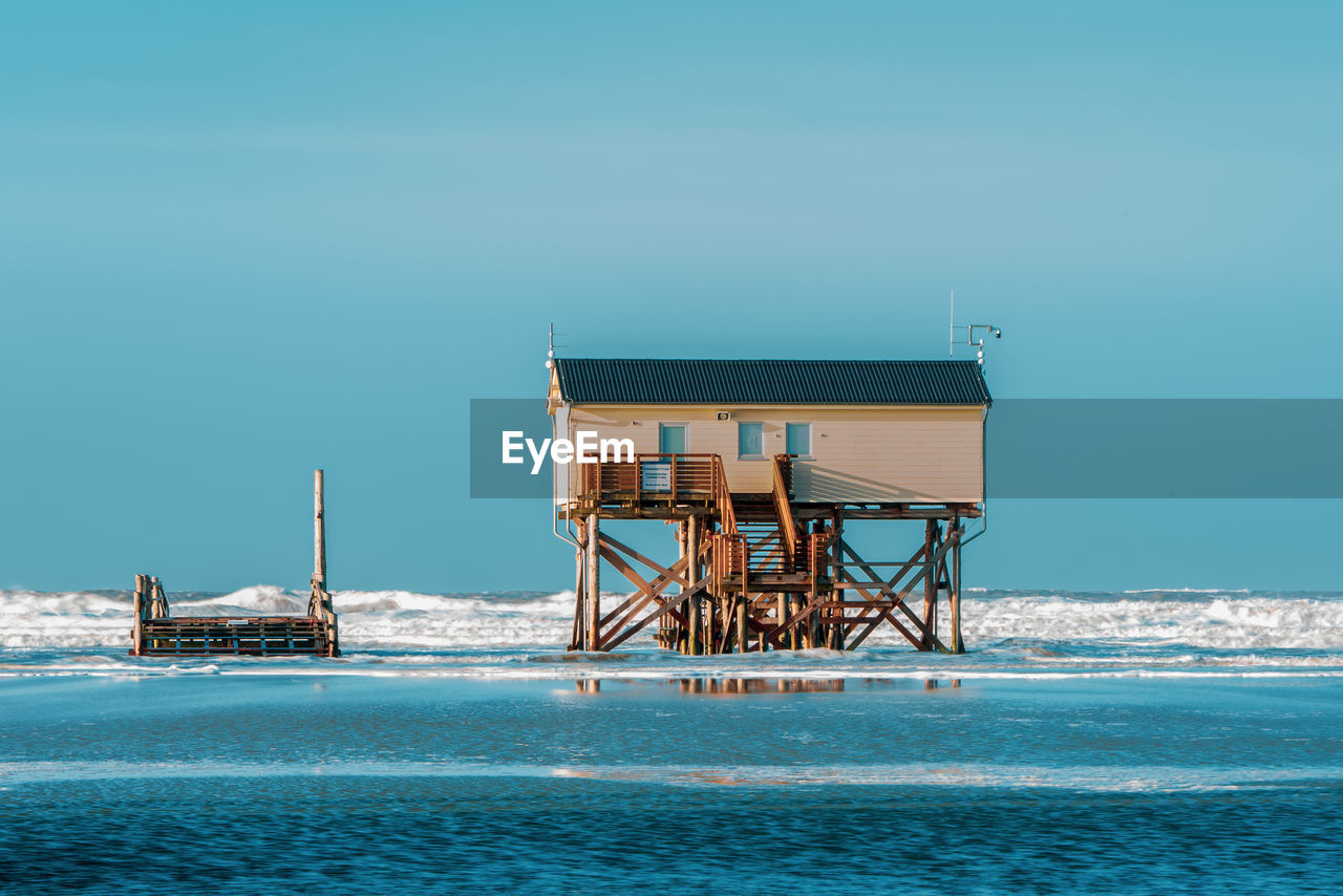 Pile dwelling on the beach of sankt peter-ording in germany.