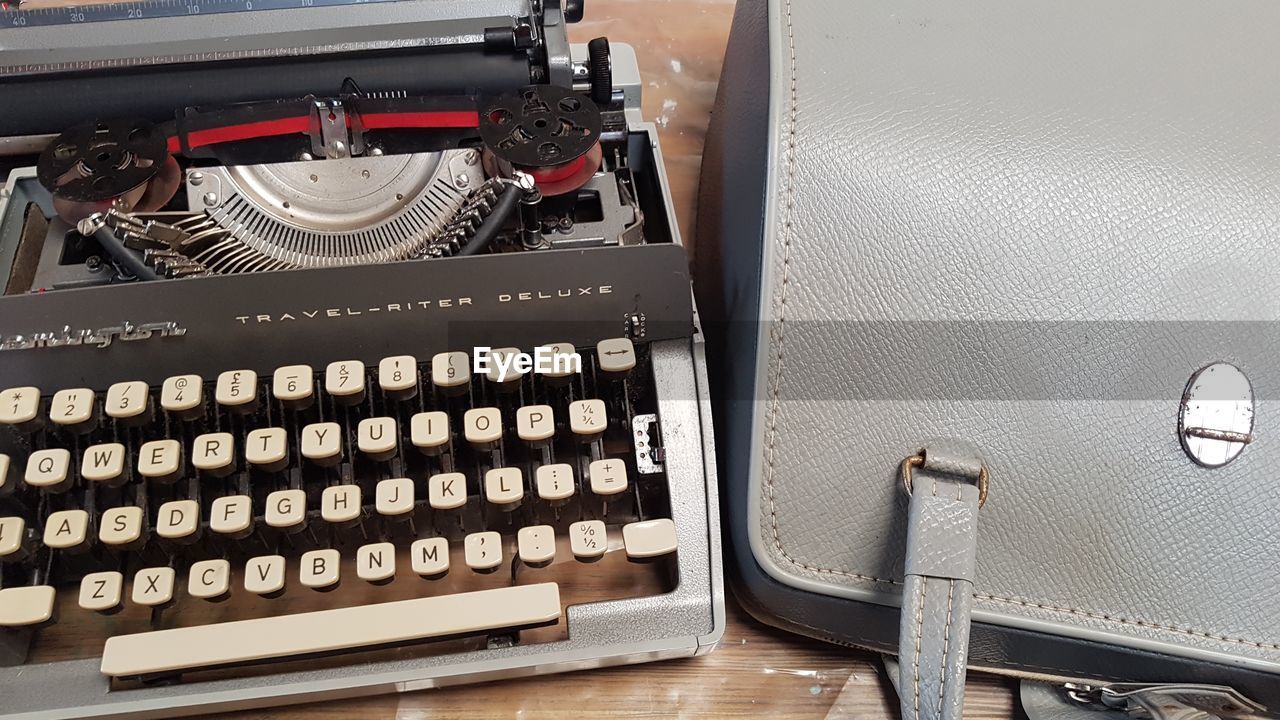 HIGH ANGLE VIEW OF OLD TELEPHONE ON TABLE