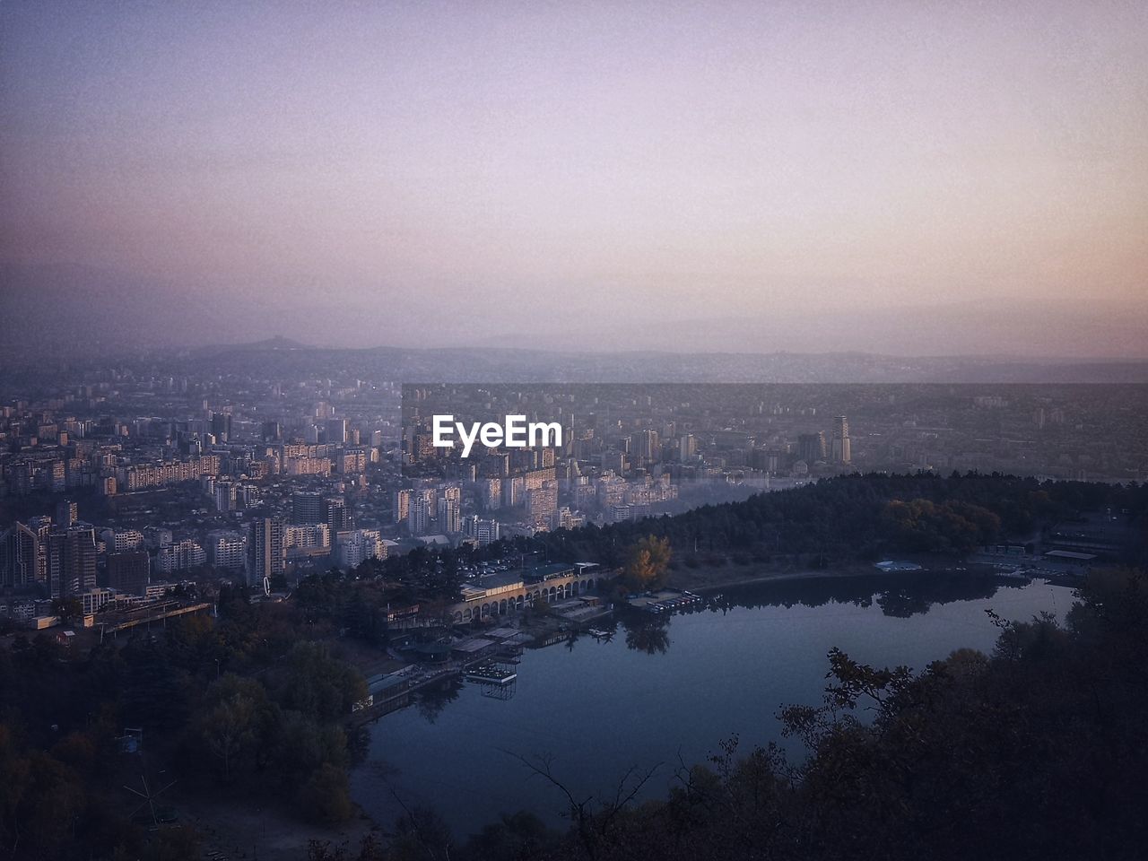 High angle view of buildings against sky at dusk