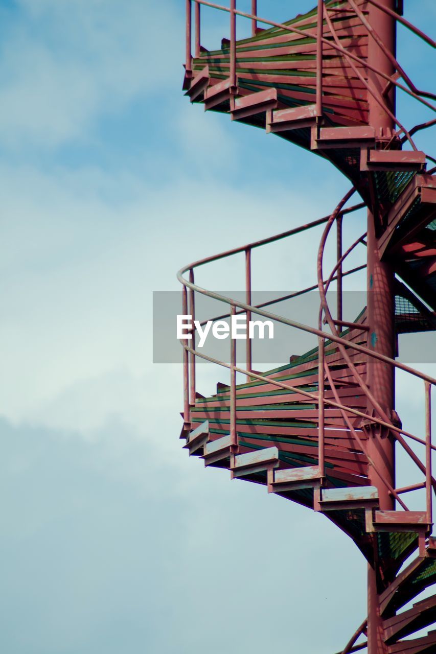 Low angle view of spiral staircase against sky