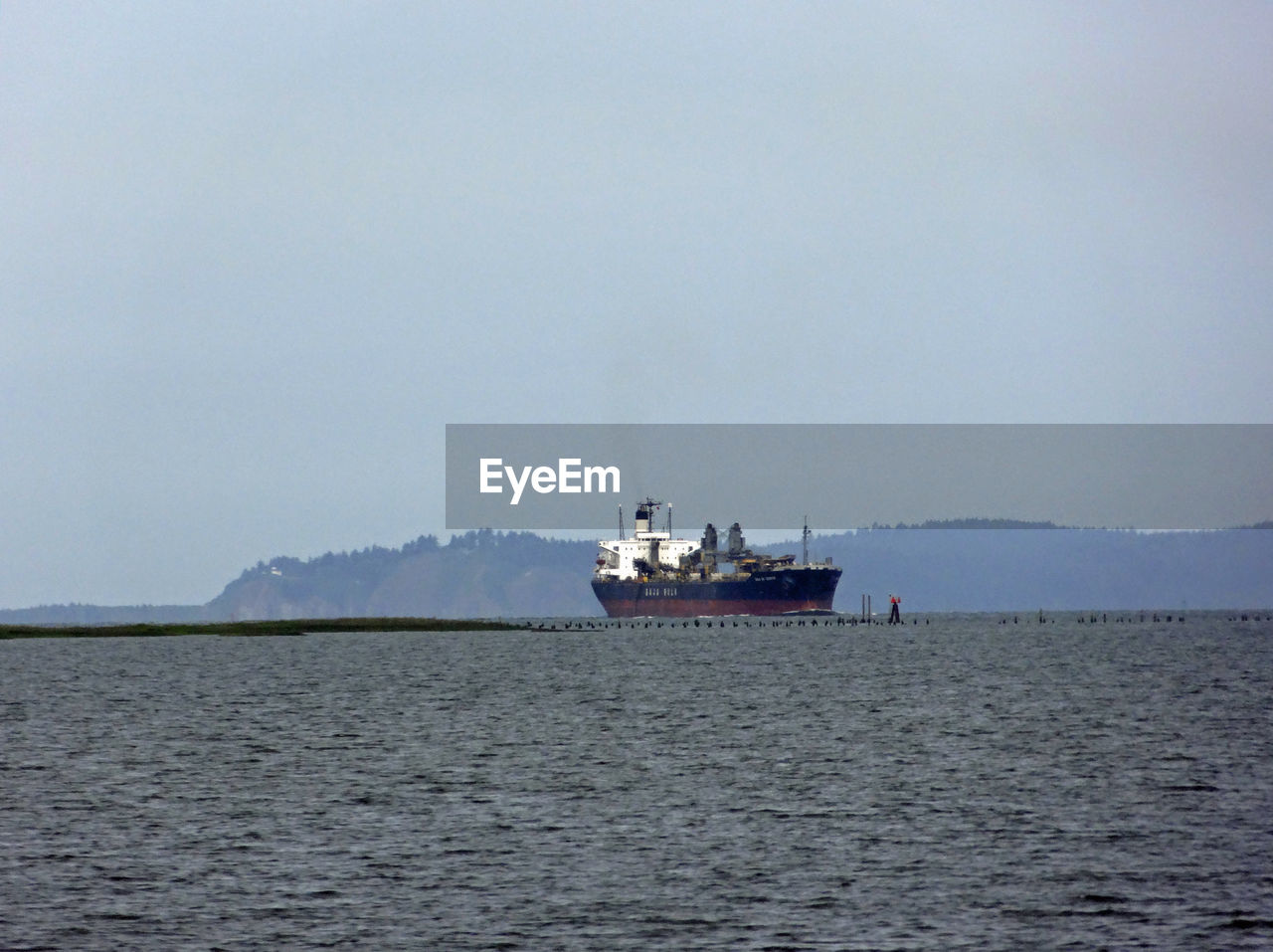 NAUTICAL VESSEL SAILING ON SEA AGAINST SKY