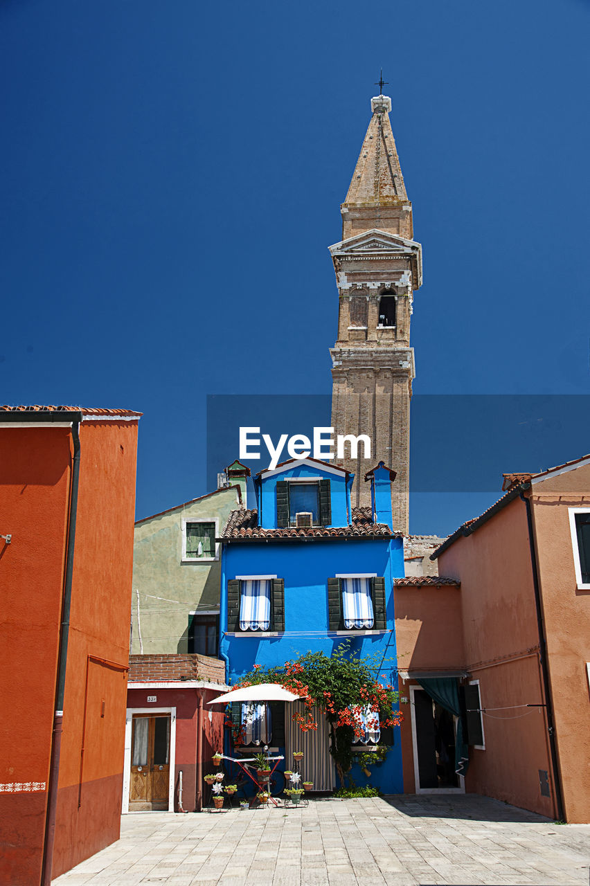 Low angle view of building against clear blue sky