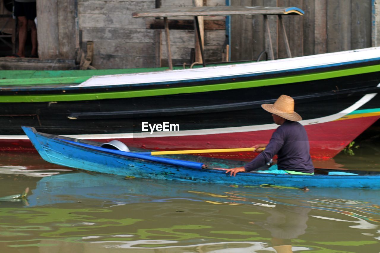 Man in boat on canal