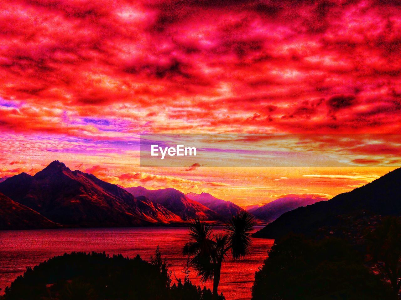 SCENIC VIEW OF SILHOUETTE MOUNTAINS AGAINST ROMANTIC SKY
