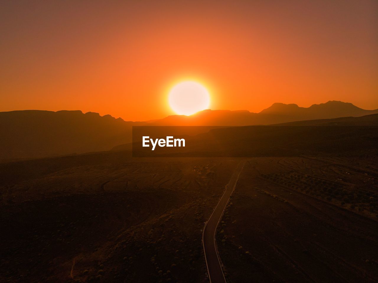 Scenic view of landscape against sky during sunset