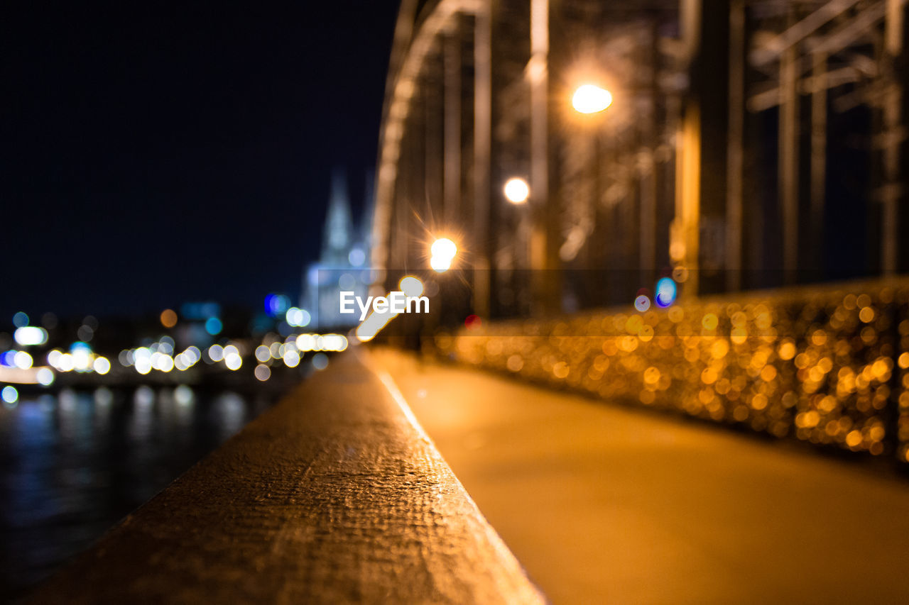 ILLUMINATED STREET LIGHTS AT NIGHT