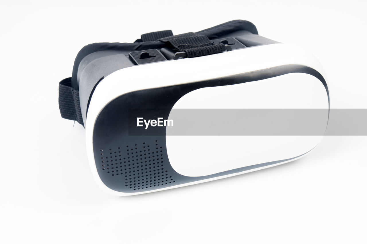 Close-up of virtual reality simulator against white background
