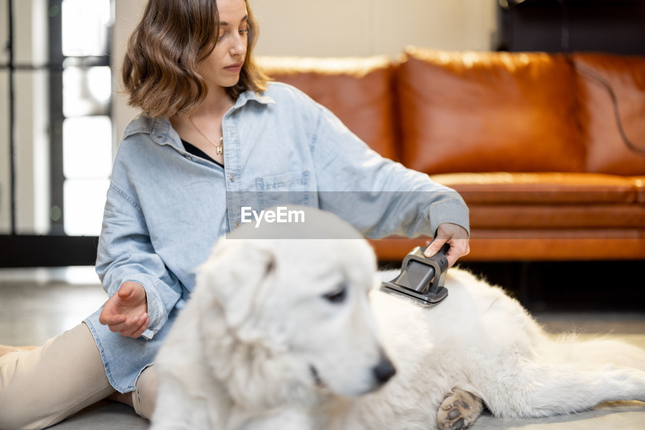 Woman with dog at home