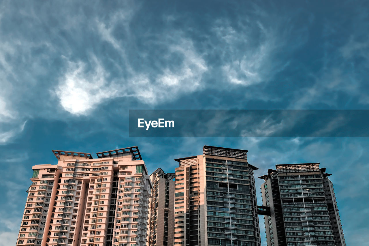 Low angle view of apartment buildings against sky