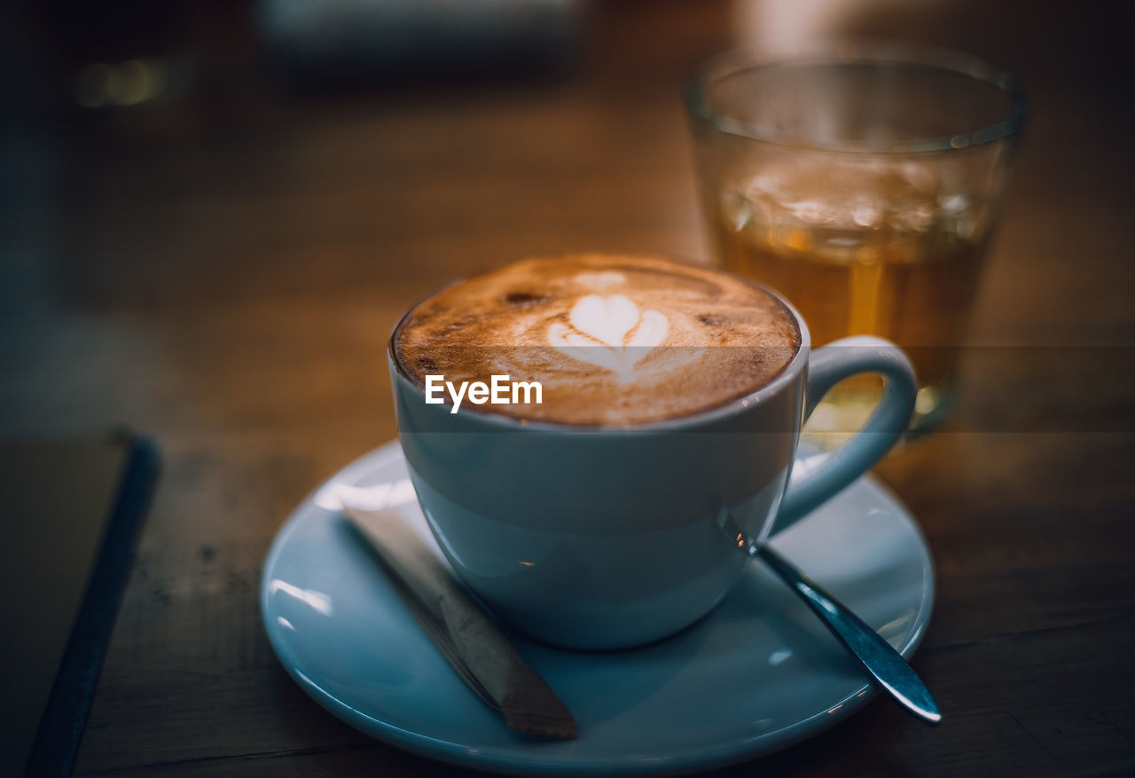 Close-up of cappuccino on table