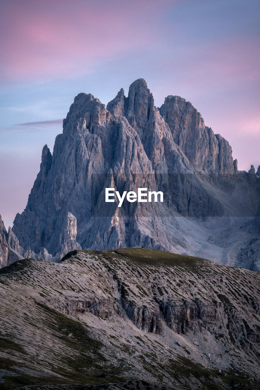 landscape, environment, mountain, scenics - nature, sky, beauty in nature, wilderness, nature, rock, travel destinations, land, mountain range, travel, sunset, cloud, no people, terrain, outdoors, cold temperature, water, non-urban scene, tourism, rock formation, plateau, snow, tranquility, dawn, ridge, mountain peak, winter, geology, summit, extreme terrain, ice