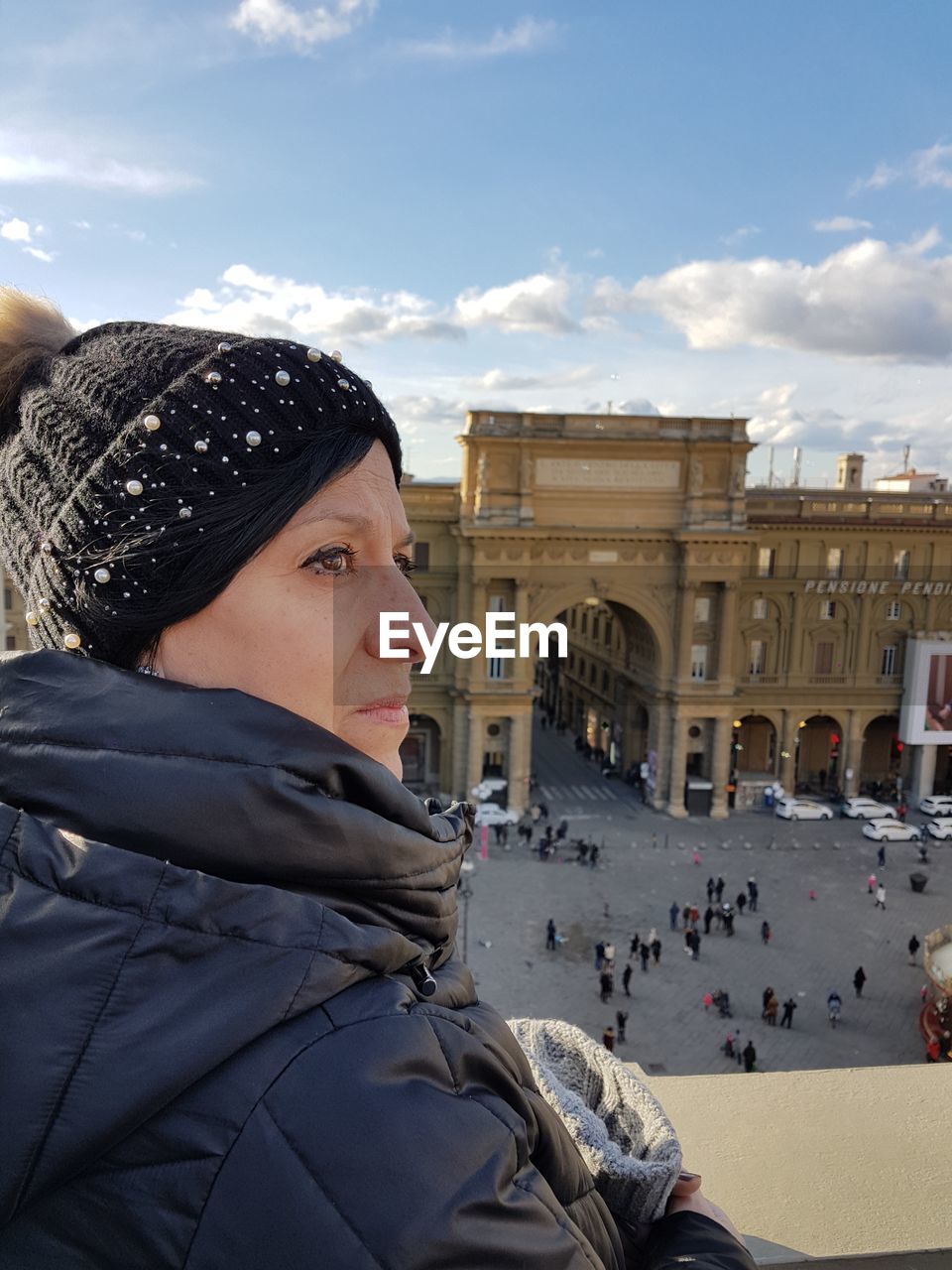 WOMAN IN TOWN SQUARE