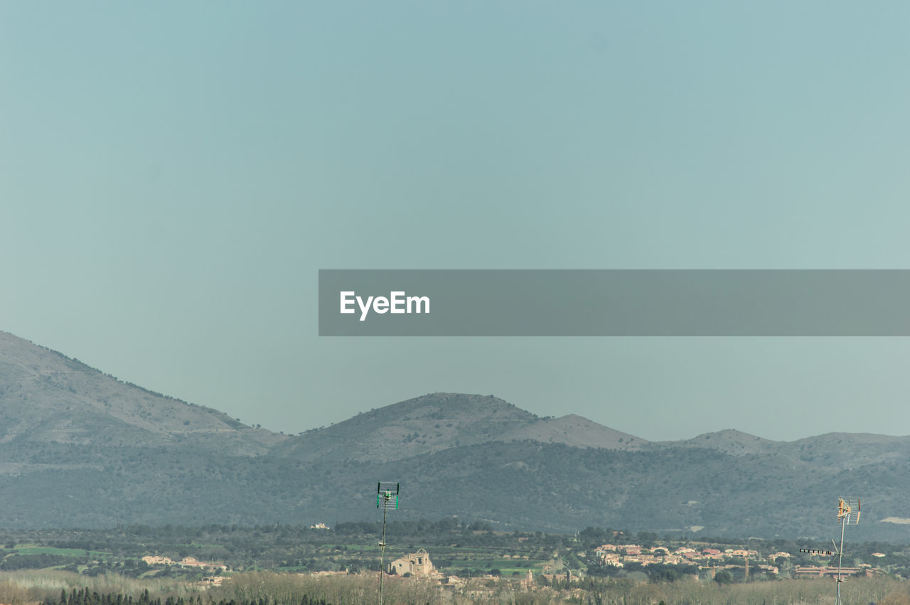 Scenic view of mountains against clear sky