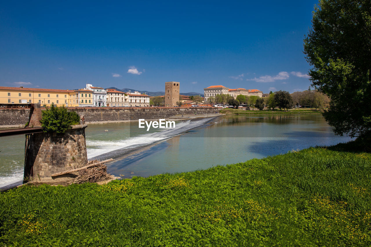 Arno river and torre della zecca a defense tower of florence on the east side of the city