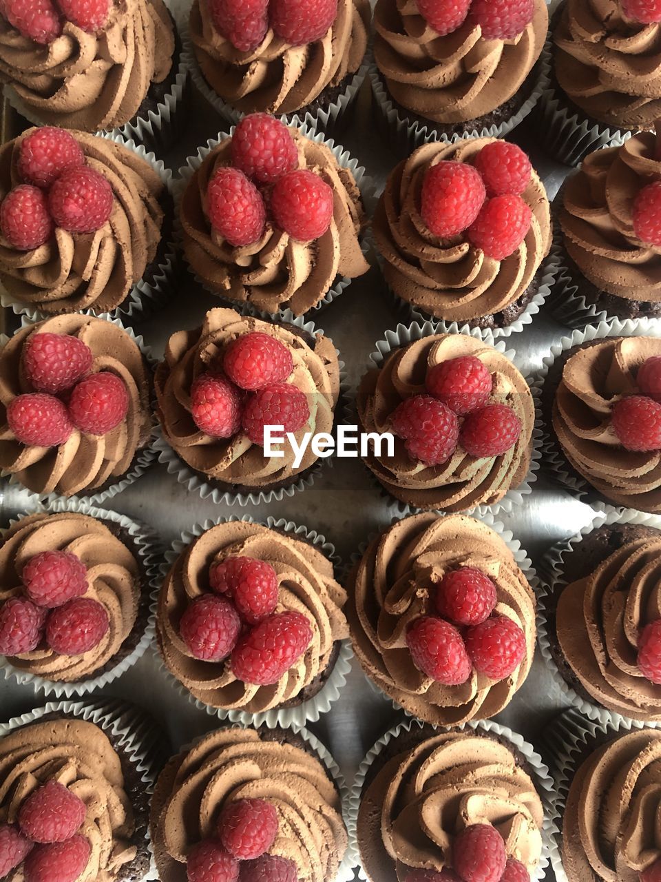 Full frame shot of raspberry cupcakes 